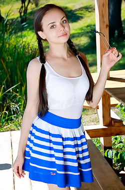 Mia Grandi Pigtailed Beauty Smiles Flirtatiously