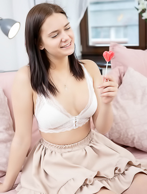 Tina Howl Flirty Look In Her Gorgeous Blue Eyes As She Sucks Her Lollipop