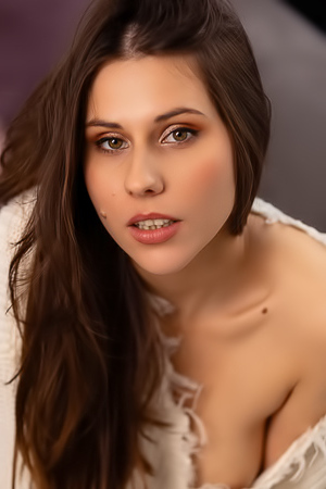 Amber Slassh Teases With Perky Nipples And Spread Legs On The Couch
